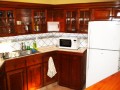 Full kitchen, but the restaurant is across the street on the water and has fresh food for cheap