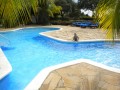 The clubhouse has a pool, restaurant and bar on the beach. (little grom)