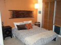 downstairs bedroom with nice tempurpedic bed, down comforter